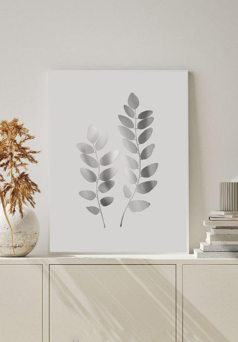 plakat z dwoma liśćmi akacji